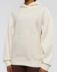 Woman wearing Shadow Mode Oversized Hoodie - Off White | Model:Rosie | Size:XS