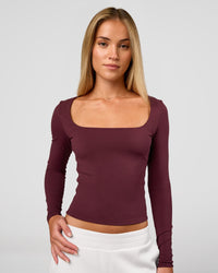 Woman wearing Show It Off Long Sleeve Top in Cherry Lacquer | Model:Issy | Size:XS | Thumbnail Index: 2