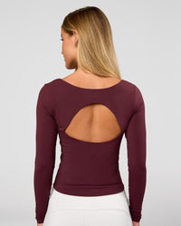 Woman wearing Show It Off Long Sleeve Top in Cherry Lacquer | Model:Issy | Size:XS | Thumbnail Index: 0