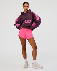 Woman wearing Slam Cropped Oversized Hoodie - Midnight Plum-Ultra Fuchsia | Model:Brylee | Size:XS