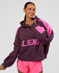 Woman wearing Slam Cropped Oversized Hoodie - Midnight Plum-Ultra Fuchsia | Model:Brylee | Size:XS