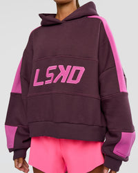 Woman wearing Slam Cropped Oversized Hoodie - Midnight Plum-Ultra Fuchsia | Model:Brylee | Size:XS