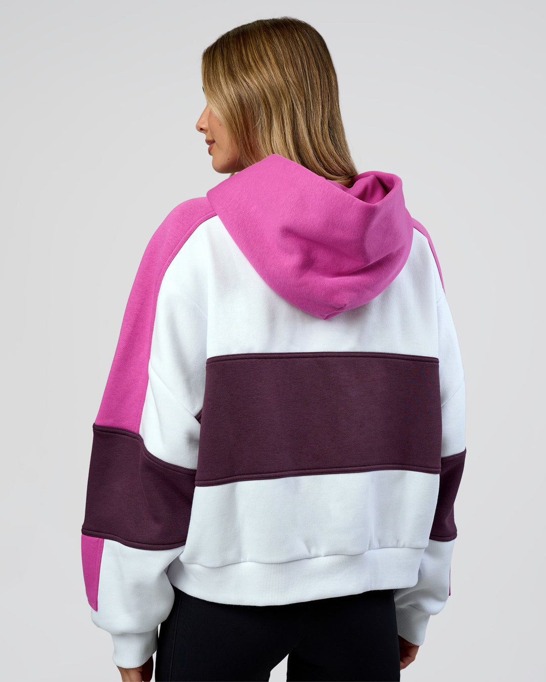 Woman wearing Slam Cropped Oversized Hoodie - White-Ultra Fuchsia | Model:Leilani | Size:XS