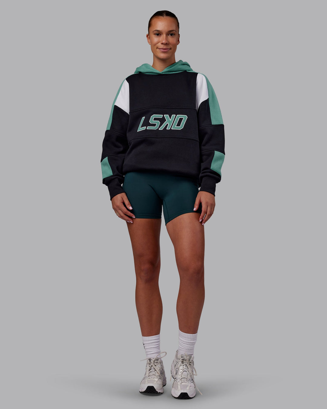 Woman wearing Slam Oversized Hoodie - Caviar-Agate Green | Model:Charlize | Size:XS