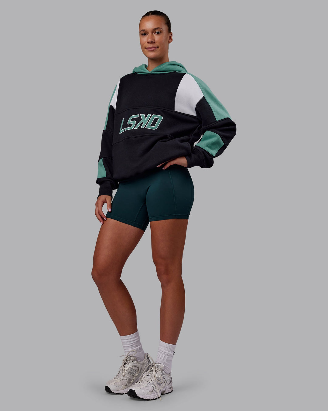 Woman wearing Slam Oversized Hoodie - Caviar-Agate Green | Model:Charlize | Size:XS