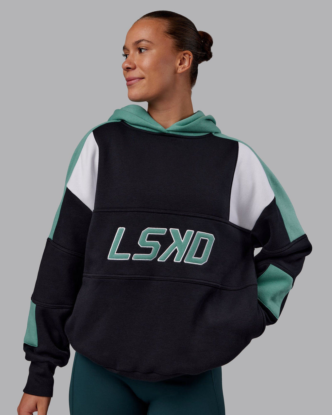Woman wearing Slam Oversized Hoodie - Caviar-Agate Green | Model:Charlize | Size:XS