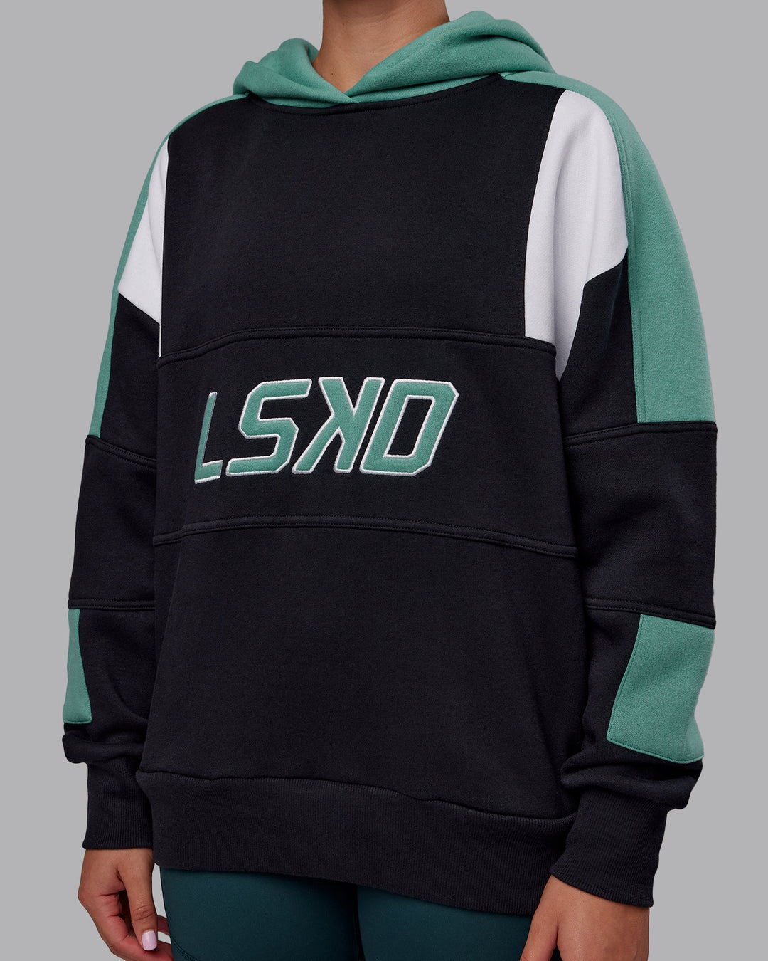 Woman wearing Slam Oversized Hoodie - Caviar-Agate Green | Model:Charlize | Size:XS