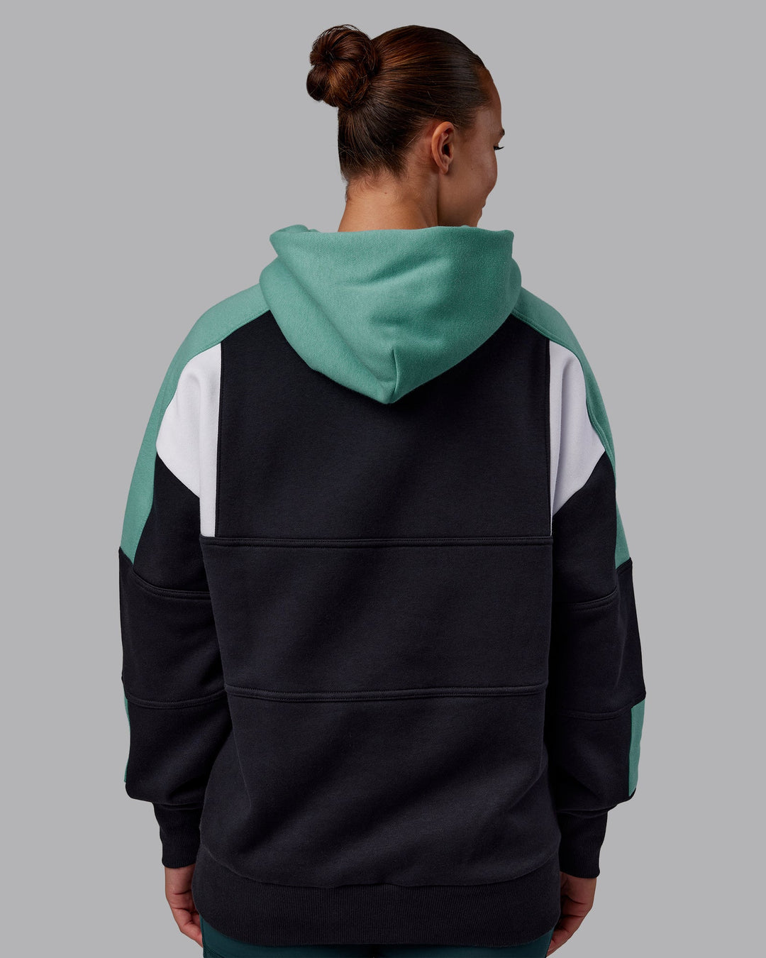 Woman wearing Slam Oversized Hoodie - Caviar-Agate Green | Model:Charlize | Size:XS