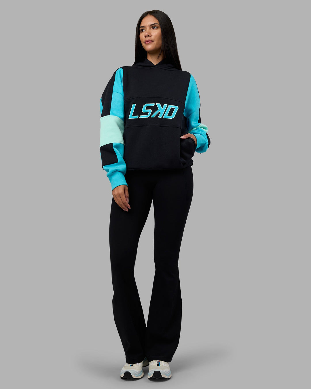 Woman wearing Slam Oversized Hoodie - Caviar-Blue Atoll | Model:Rhiley | Size:XS