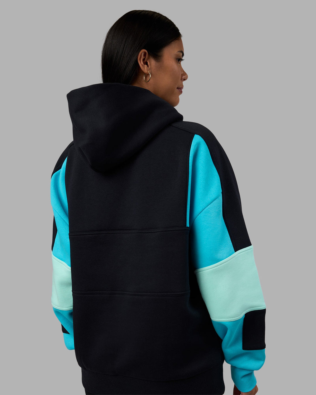 Woman wearing Slam Oversized Hoodie - Caviar-Blue Atoll | Model:Rhiley | Size:XS