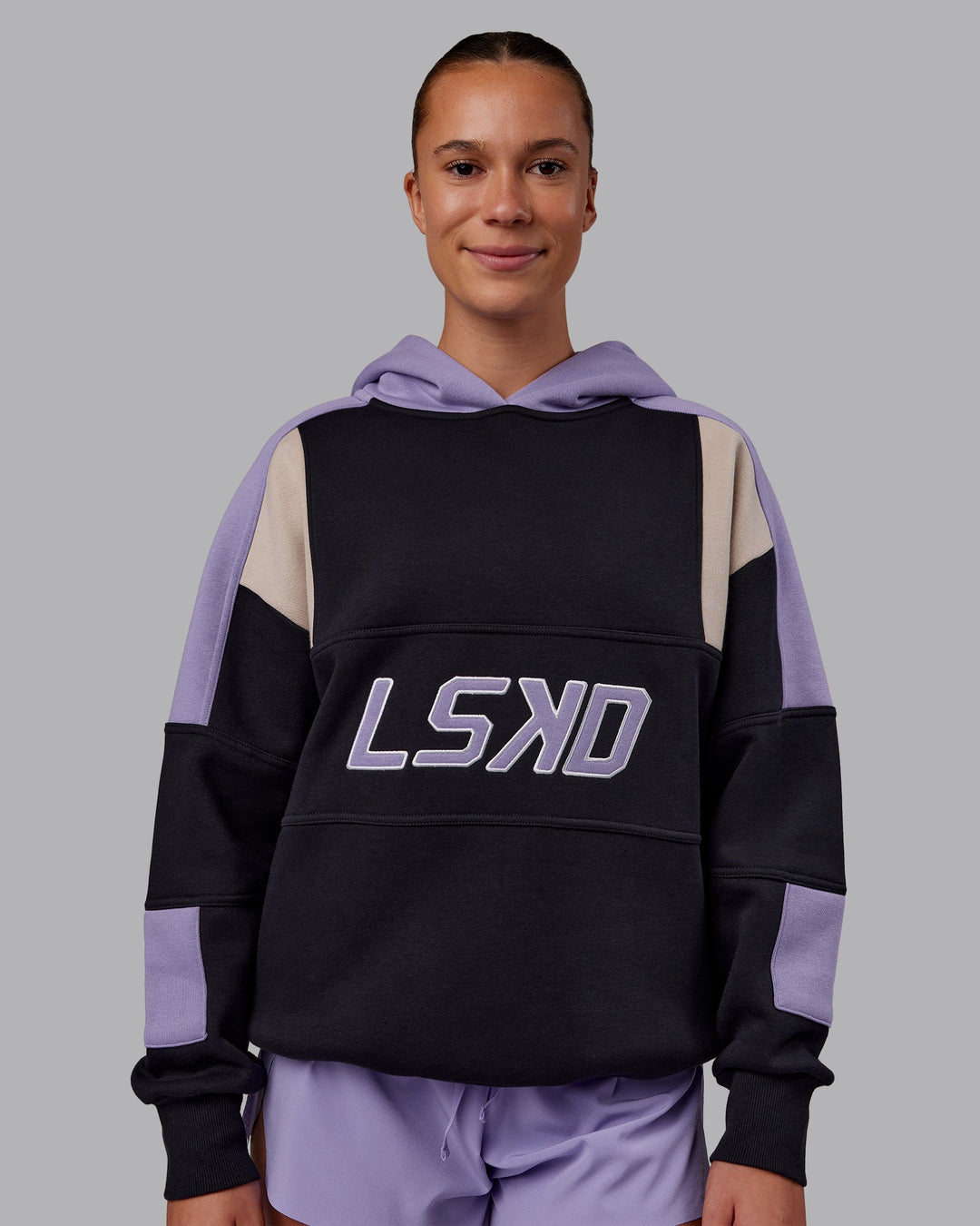 Woman wearing Slam Oversized Hoodie - Caviar-Violet Ray | Model:Charlize | Size:XS