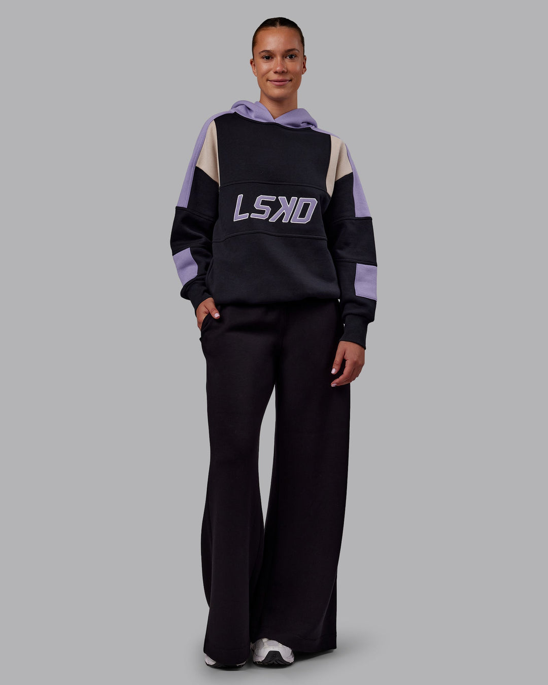 Woman wearing Slam Oversized Hoodie - Caviar-Violet Ray | Model:Charlize | Size:XS