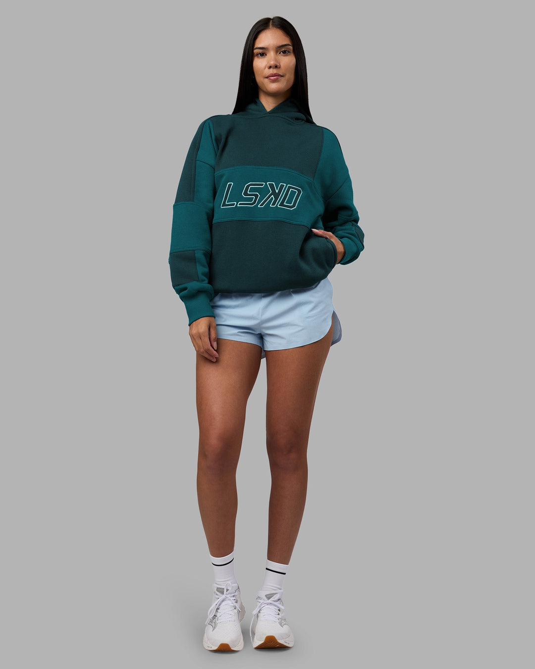 Woman wearing Slam Oversized Hoodie - Deep Sea-Blue Coral | Model:Rhiley | Size:XS