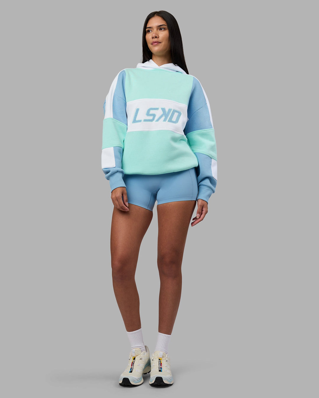 Woman wearing Slam Oversized Hoodie - Glacier Lake-Water Spout | Model:Rhiley | Size:XS