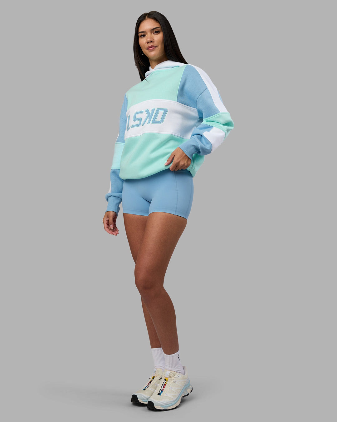 Woman wearing Slam Oversized Hoodie - Glacier Lake-Water Spout | Model:Rhiley | Size:XS