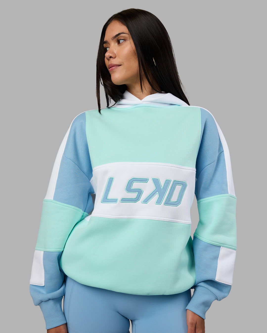 Woman wearing Slam Oversized Hoodie - Glacier Lake-Water Spout | Model:Rhiley | Size:XS