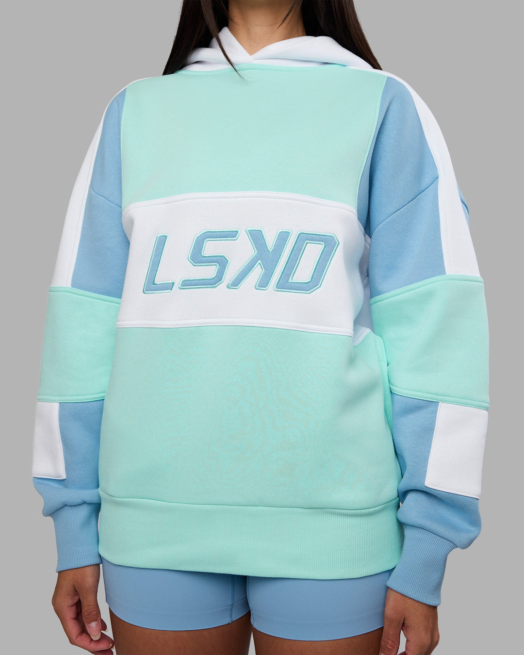 Woman wearing Slam Oversized Hoodie - Glacier Lake-Water Spout | Model:Rhiley | Size:XS