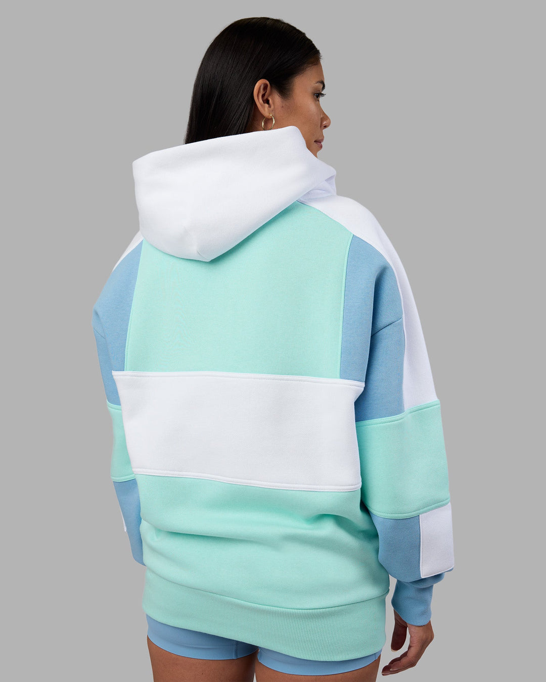 Woman wearing Slam Oversized Hoodie - Glacier Lake-Water Spout | Model:Rhiley | Size:XS