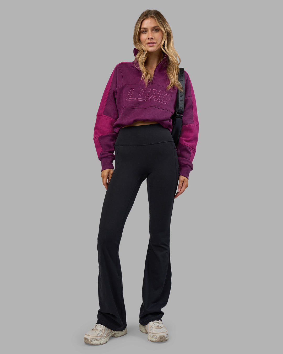 Woman wearing Slam Quarter Zip Sweater - Plum Caspia-Boysenberry | Model:Leilani | Size:XS