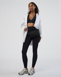 Woman wearing Stamina Sports Bra D/DD/E - Black | Model:Jordan | Size:XS