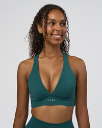 Woman wearing Stamina Sports Bra D/DD/E - Transformative Teal | Model:Jordan | Size:XS