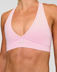 Woman wearing Stamina Sports Bra - Marshmallow | Set:true | Angle:closeup | Model:Emelia | Size:XS