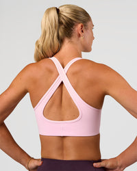 Woman wearing Stamina Sports Bra - Marshmallow | Set:true | Angle:back | Model:Emelia | Size:XS