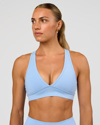 Woman wearing Stamina Sports Bra - Open Air | Set:true | Angle:front | Model:Maja | Size:XS