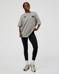 Woman wearing Static Grit Heavyweight Oversized Tee - Alloy-Black | Model:Ellie | Size:XS