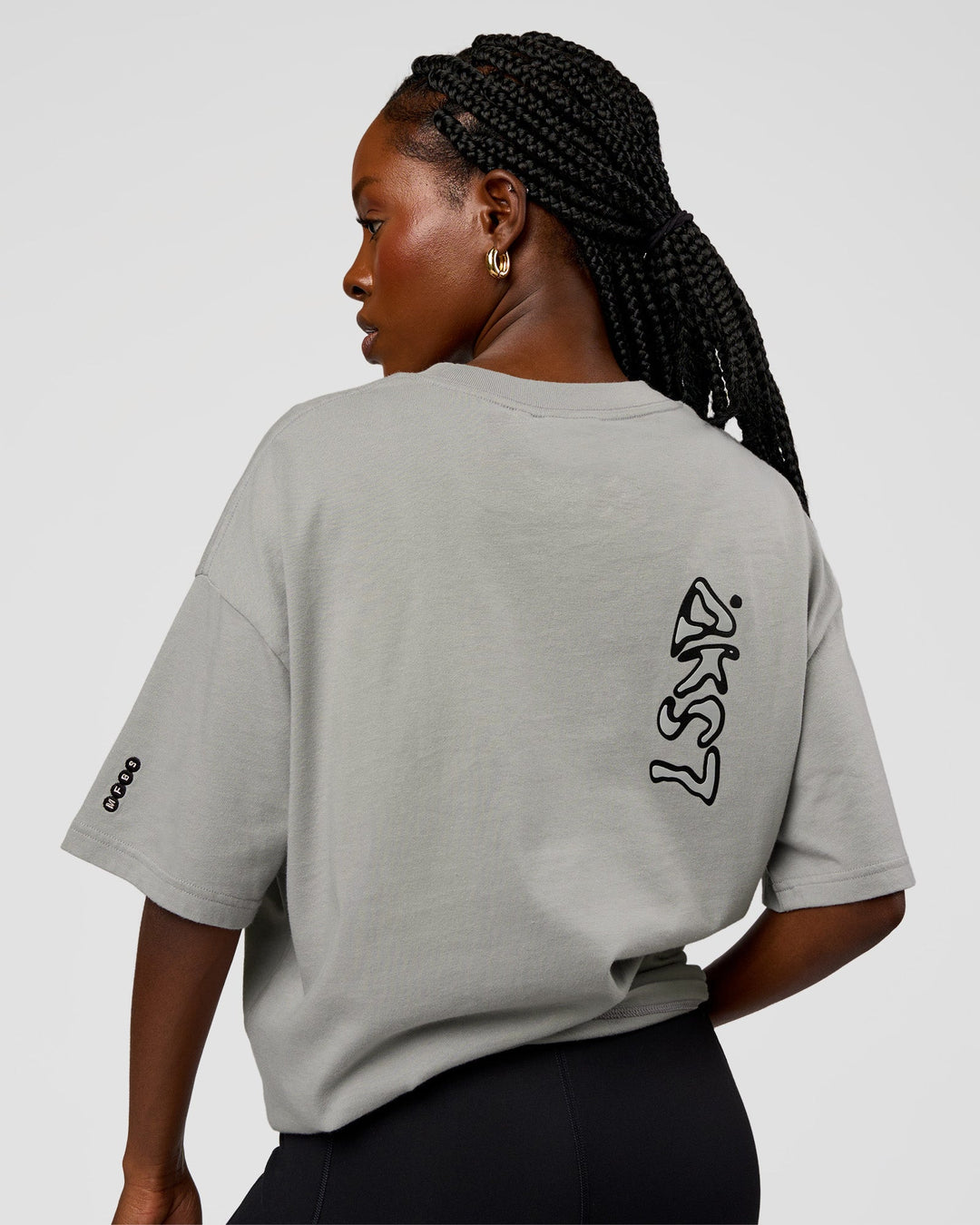 Woman wearing Static Grit Heavyweight Oversized Tee - Alloy-Black | Model:Ellie | Size:XS