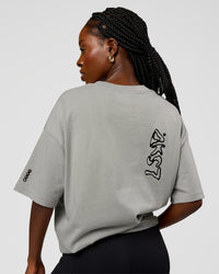 Woman wearing Static Grit Heavyweight Oversized Tee - Alloy-Black | Model:Ellie | Size:XS