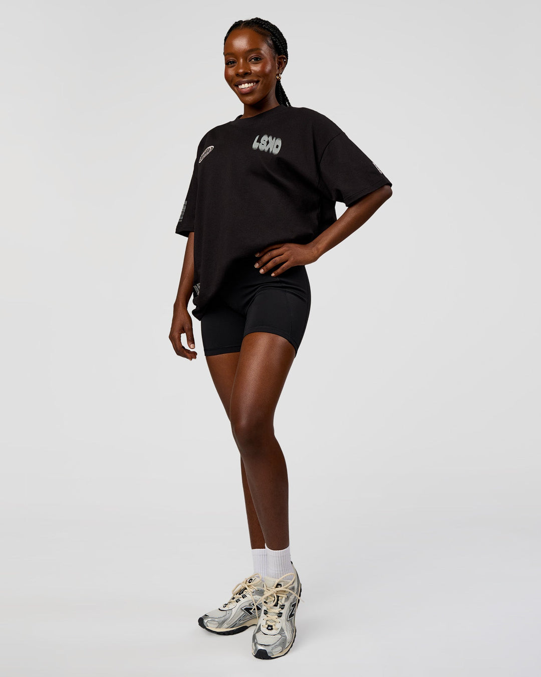 Woman wearing Static Grit Heavyweight Oversized Tee - Black-Alloy | Model:Ellie | Size:XS