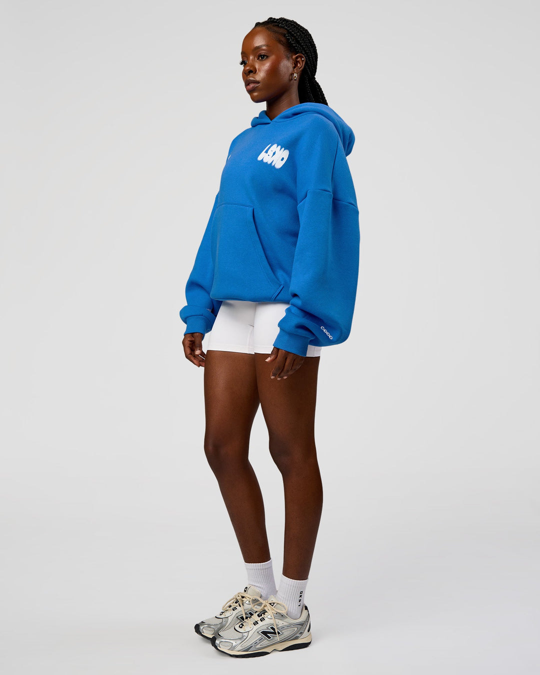 Woman wearing Static Grit Unisex Boxy Hoodie - Palace Blue-White | Model:Ellie | Size:XS