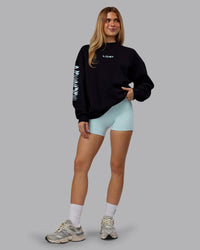 Woman wearing Static Oversized Sweater - Black-Skyride | Model:Emilie | Size:XS