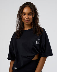 Woman wearing Sticker Heavyweight Oversized Tee - Black-White | Model:Jordan | Size:XS