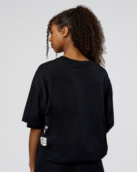 Woman wearing Sticker Heavyweight Oversized Tee - Black-White | Model:Jordan | Size:XS
