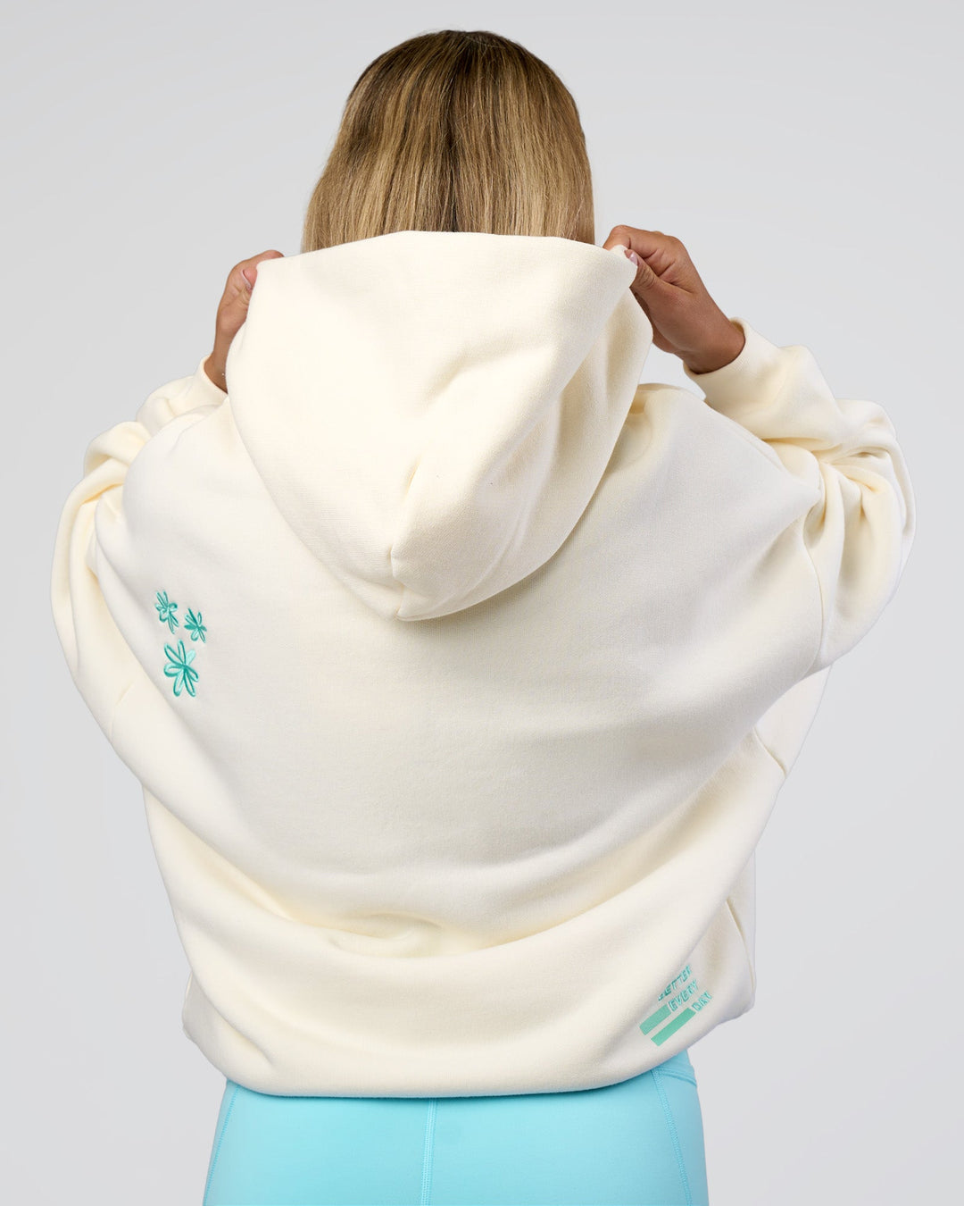 Woman wearing Sticker Unisex Oversized Hoodie - Off White-Jelly Mint | Model:Amity | Size:XS