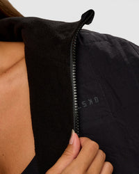 Woman wearing Thrive Reversible Jacket - Black | Model:Brylee | Size:XS
