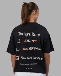 Woman wearing Today's Run FLXCotton Oversized Tee - Black-White | Model:Charlize | Size:XS