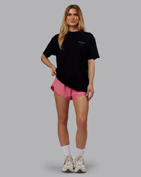 Woman wearing Trust The Process 2.0 FLXCotton Tee Oversize - Black-Blue Atoll | Model:Emilie | Size:XS