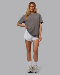 Woman wearing Trust The Process 2.0 FLXCotton Tee Oversize - Storm Front-Shale Beige | Model:Emilie | Size:XS
