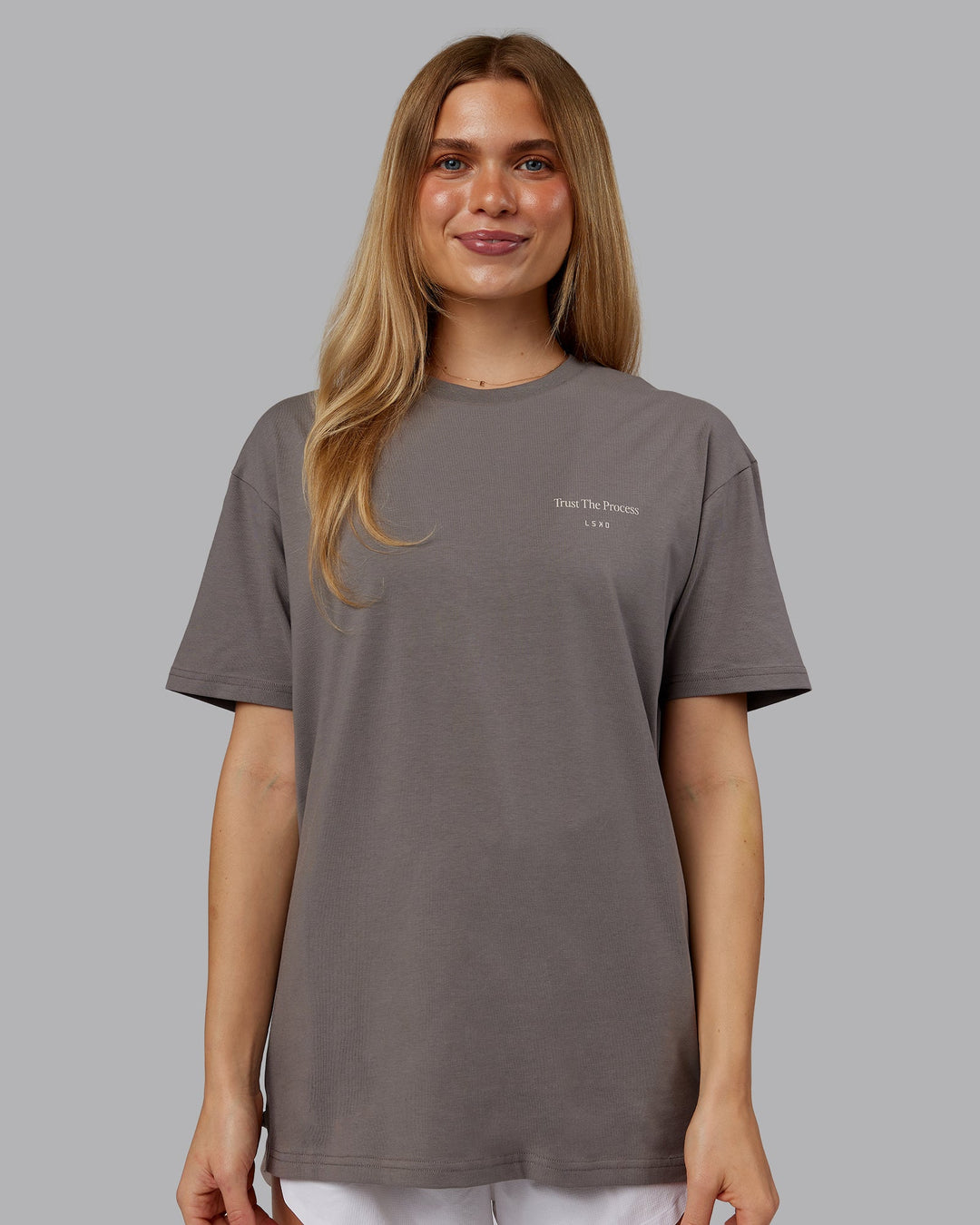 Woman wearing Trust The Process 2.0 FLXCotton Tee Oversize - Storm Front-Shale Beige | Model:Emilie | Size:XS