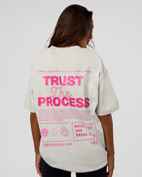 Woman wearing Trust The Process Heavyweight Unisex Oversized Tee - Digital Mist-Ultra Pink | Model:Kirstyn | Size:XS
