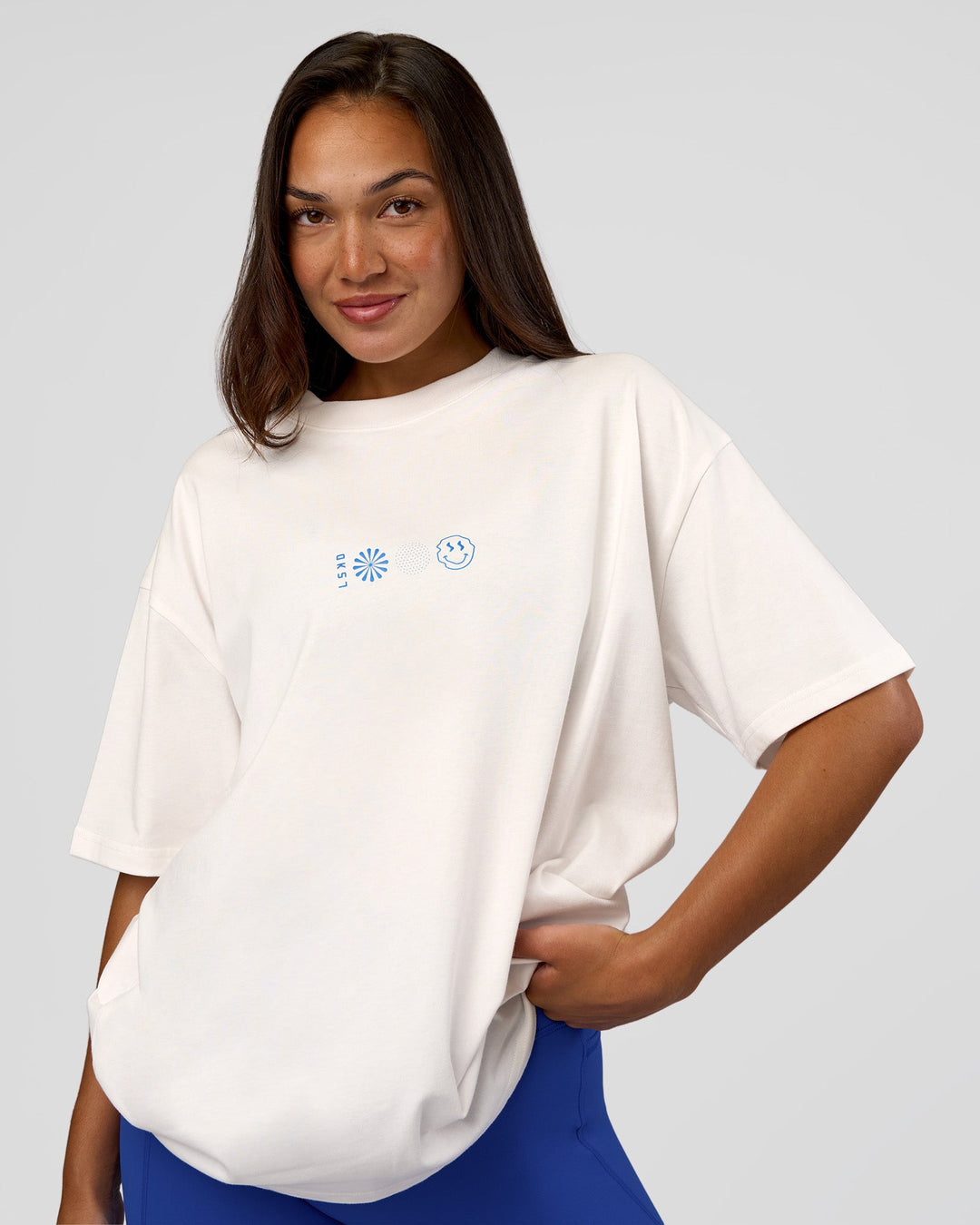 Woman wearing Trust The Process Heavyweight Unisex Oversized Tee - Off White-Electric Indigo | Model:Kirstyn | Size:XS