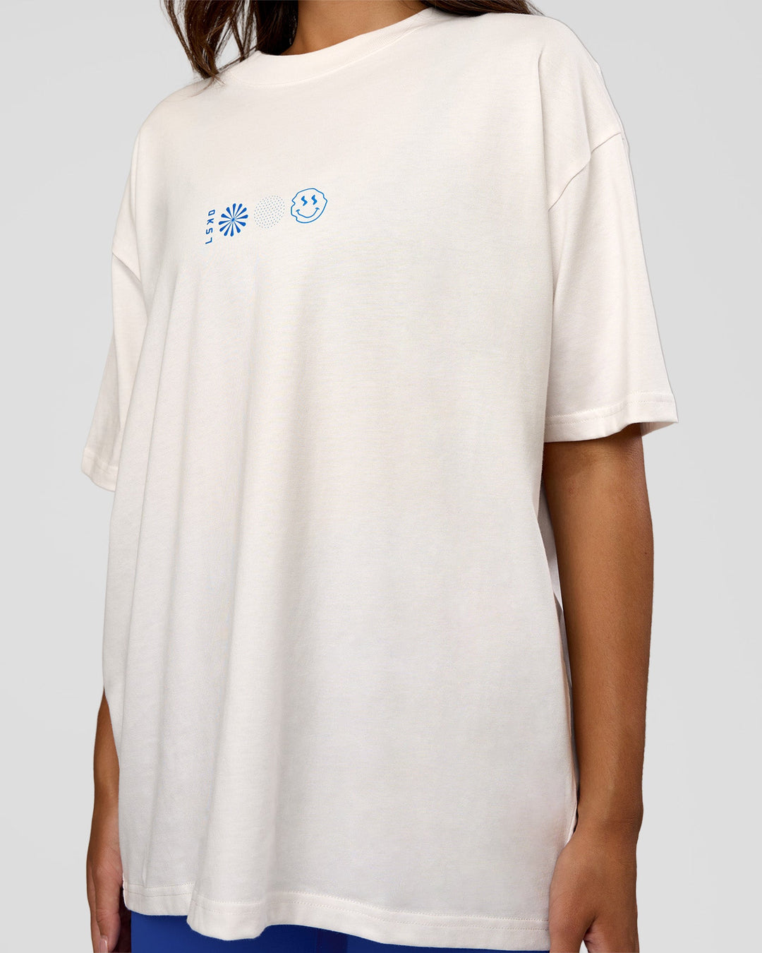 Woman wearing Trust The Process Heavyweight Unisex Oversized Tee - Off White-Electric Indigo | Model:Kirstyn | Size:XS