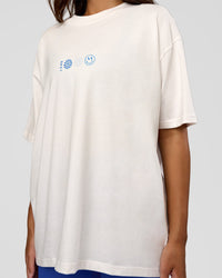 Woman wearing Trust The Process Heavyweight Unisex Oversized Tee - Off White-Electric Indigo | Model:Kirstyn | Size:XS