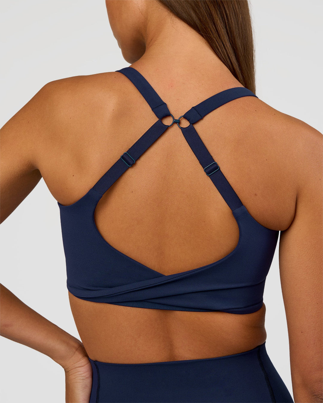 Woman wearing Twist Sports Bra D/DD/E - Future Navy | Model:Brylee | Size:XS