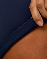 Woman wearing Twist Sports Bra D/DD/E - Future Navy | Model:Brylee | Size:XS