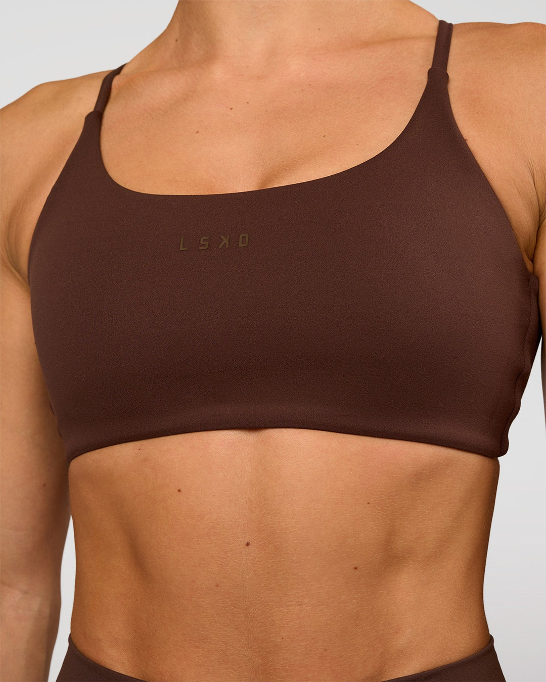 Woman wearing Twist Sports Bra - Hot Chocolate | Model:Maja | Size:XS - view 3