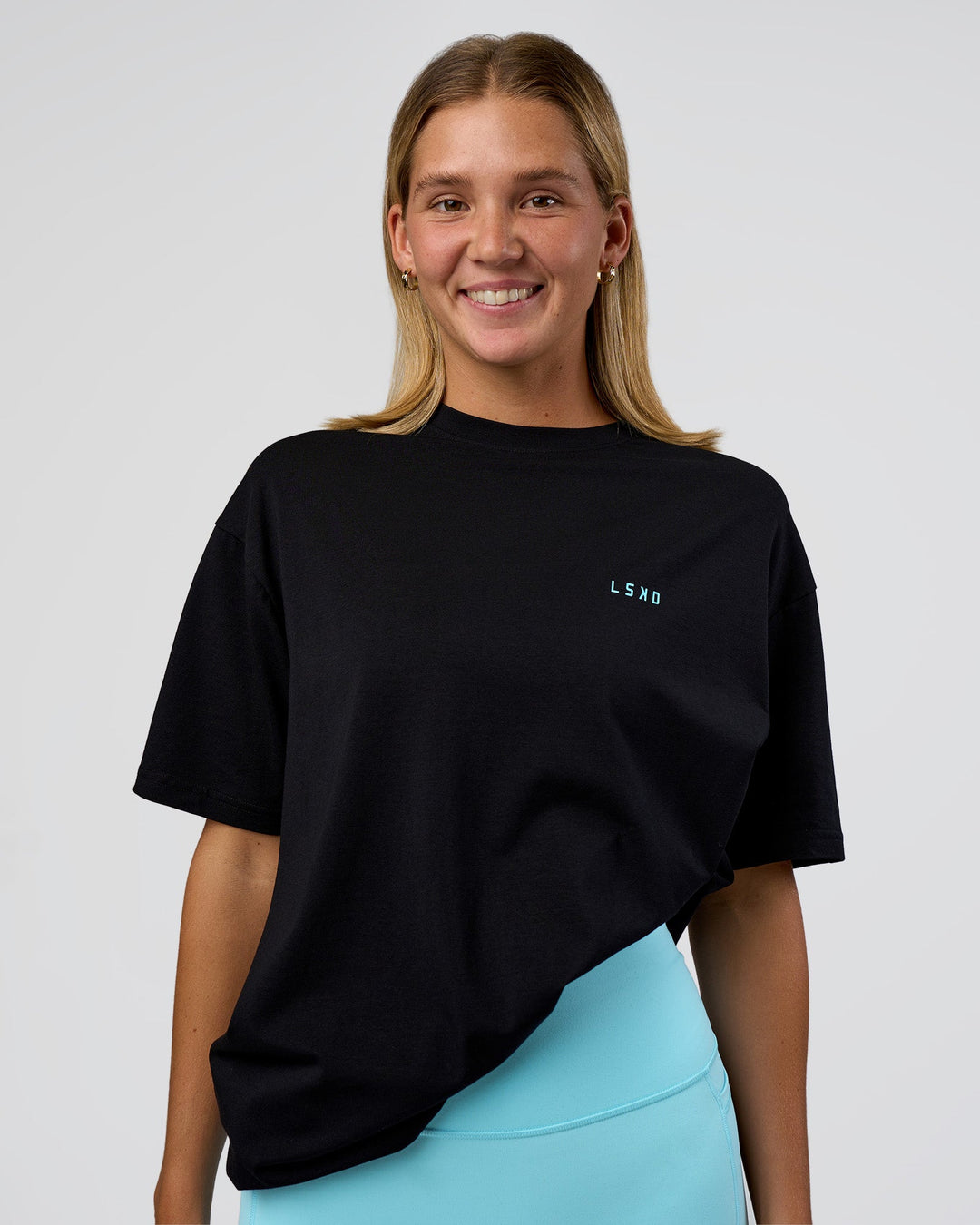 Woman wearing Unfit Club FLXCotton Oversized Tee - Black-White | Model:Amity | Size:XS